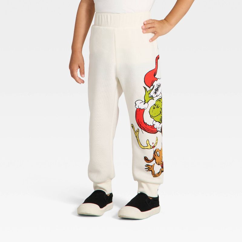 slide 4 of 4, Toddler Boys' 2pc The Grinch Christmas Fleece Sweatshirt and Jogger Set - Cream 5T, 2 ct
