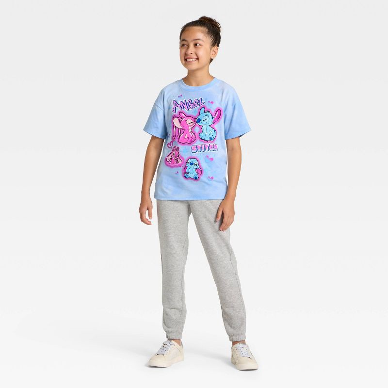 slide 4 of 4, Lilo & Stitch Girls' Disney Stitch and Angel Short Sleeve Oversized Graphic T-Shirt - Blue L, 1 ct