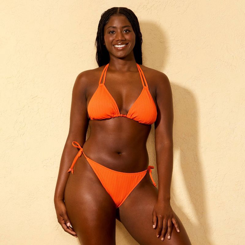 slide 4 of 5, Women's Ribbed Texture Low-Rise High Leg Extra Cheeky Side-Tie Bikini Bottom - Wild Fable™ Orange XXS, 1 ct