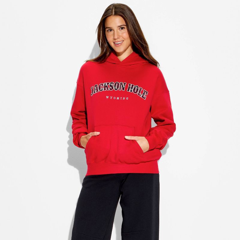 slide 1 of 3, Women's Oversized Graphic Hooded Pullover Sweatshirt - Wild Fable™ Berry Red Quote M, 1 ct