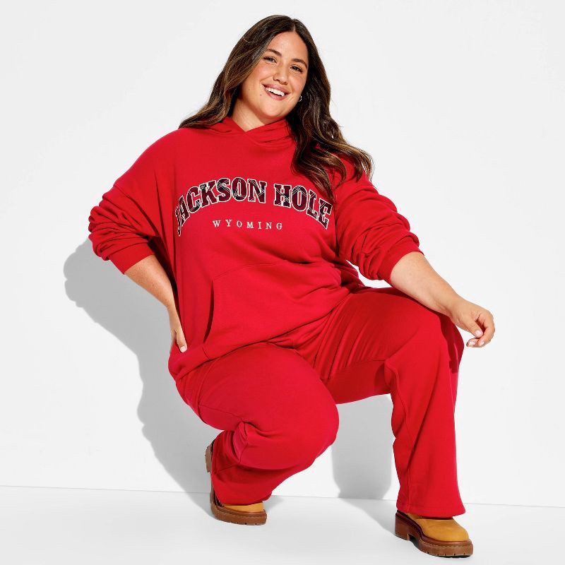 slide 1 of 3, Women's Oversized Graphic Hooded Pullover Sweatshirt - Wild Fable™ Berry Red Quote XXL, 1 ct