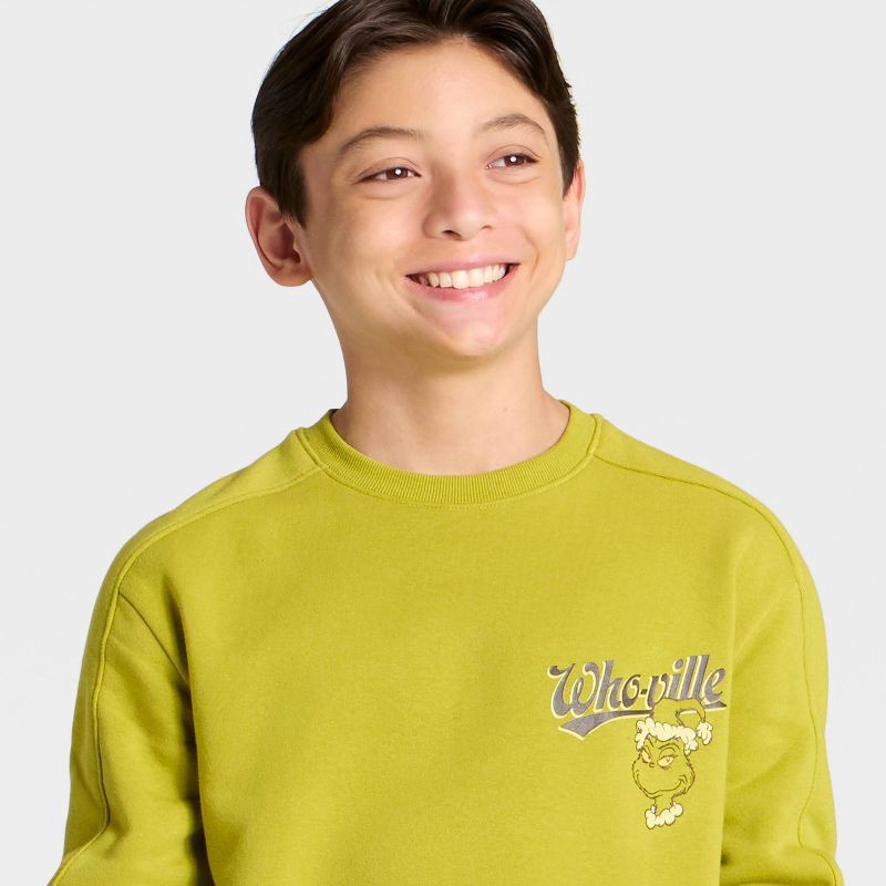 slide 2 of 4, Boys' The Grinch Whoville Front and Back Graphic Fleece Sweatshirt - Green S, 1 ct