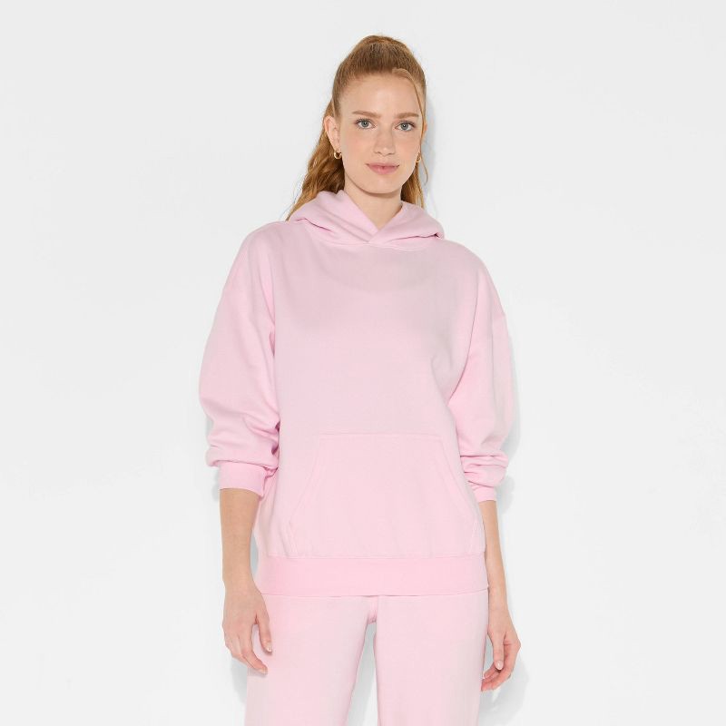 slide 2 of 3, Women's Oversized Bubble Hem Hooded Sweatshirt - Wild Fable™ Light Pink L, 1 ct