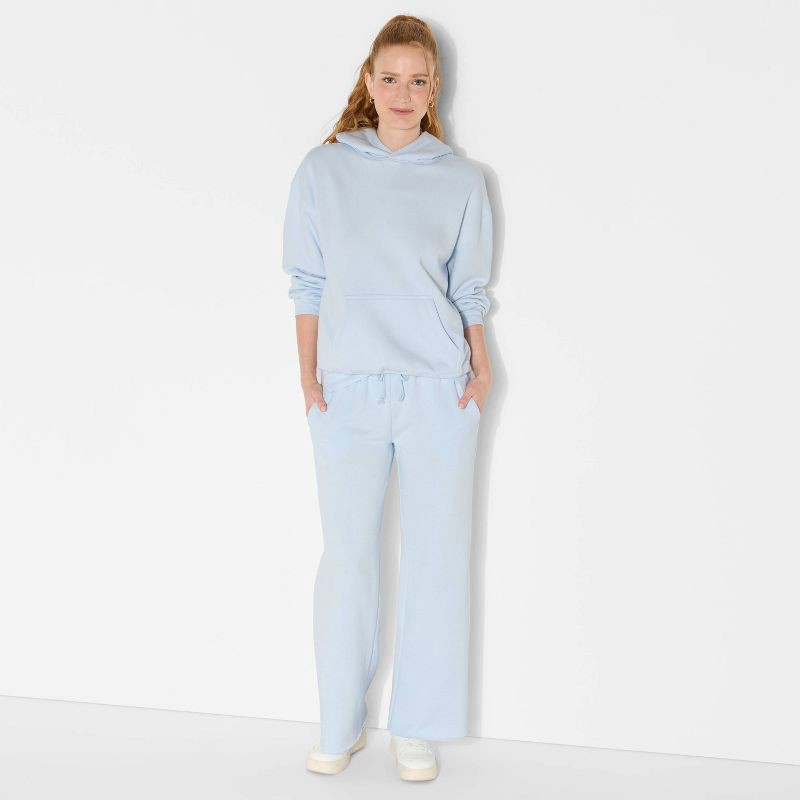 slide 1 of 3, Women's Oversized Bubble Hem Hooded Sweatshirt - Wild Fable™ Light Blue XS, 1 ct