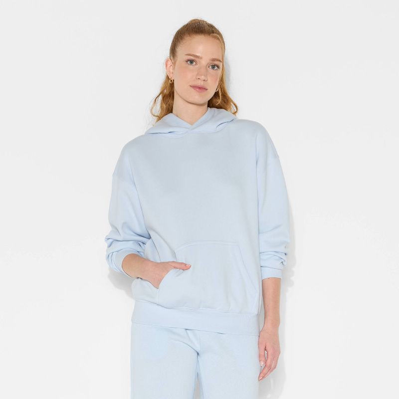 slide 2 of 3, Women's Oversized Bubble Hem Hooded Sweatshirt - Wild Fable™ Light Blue S, 1 ct