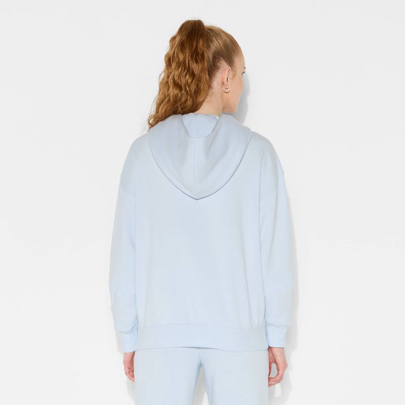 slide 3 of 3, Women's Oversized Bubble Hem Hooded Sweatshirt - Wild Fable™ Light Blue M, 1 ct
