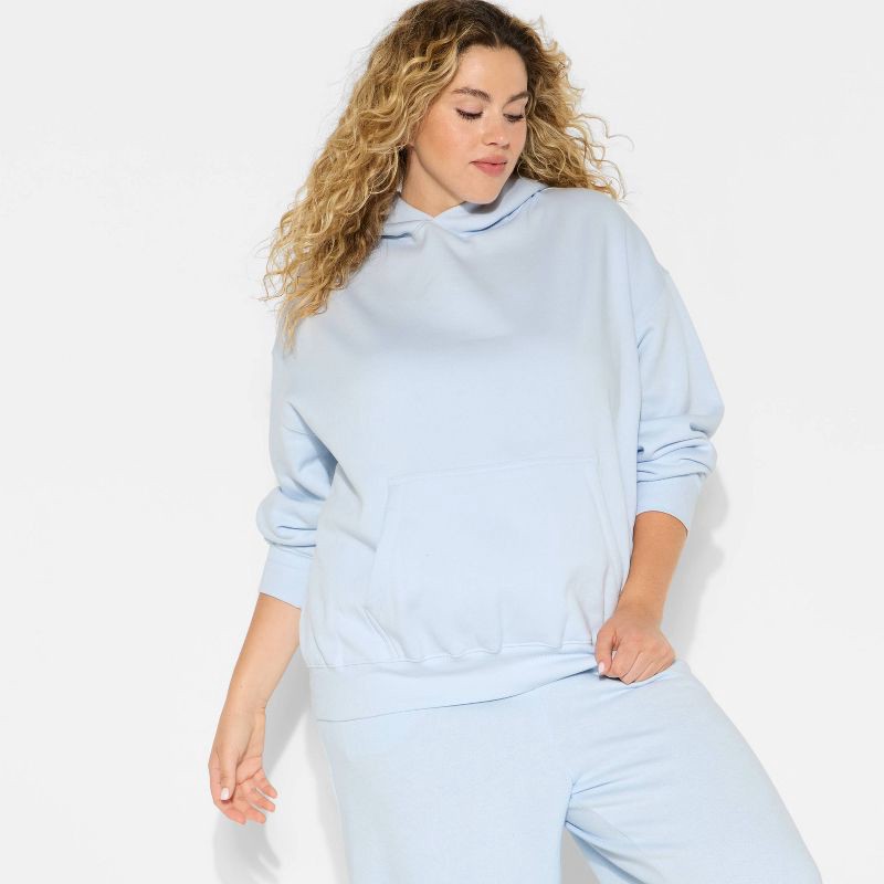 slide 1 of 3, Women's Oversized Bubble Hem Hooded Sweatshirt - Wild Fable™ Light Blue XXL, 1 ct