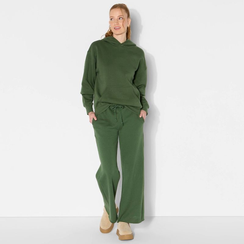 slide 1 of 3, Women's Oversized Bubble Hem Hooded Sweatshirt - Wild Fable™ Dark Green S, 1 ct