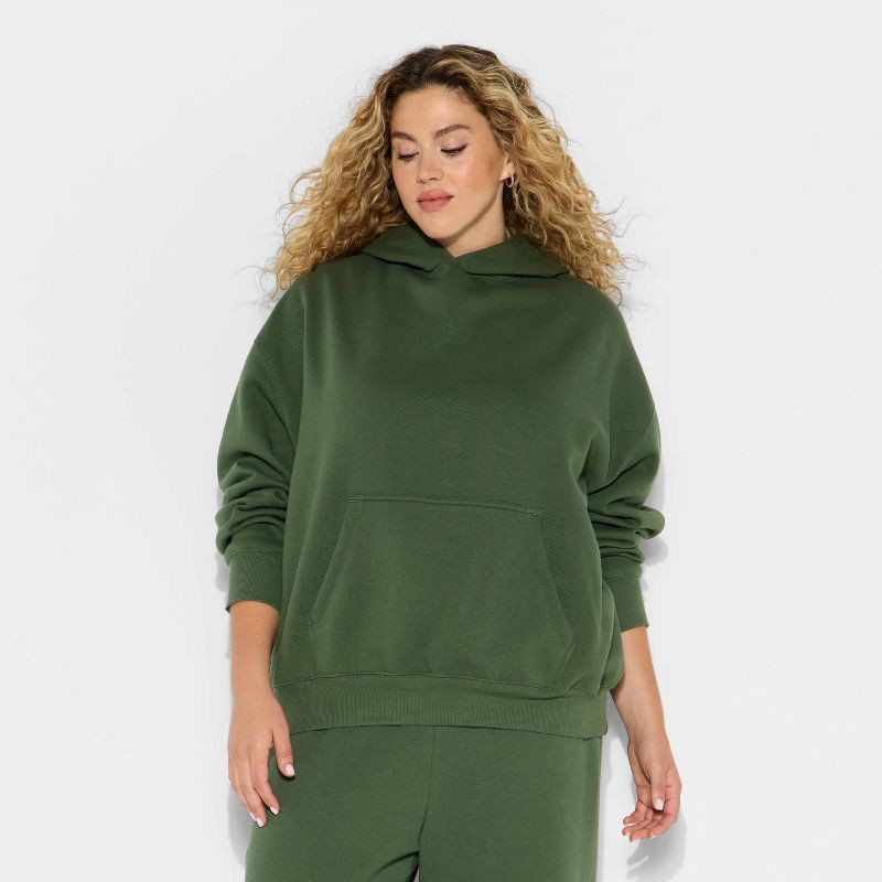 slide 2 of 3, Women's Oversized Bubble Hem Hooded Sweatshirt - Wild Fable™ Dark Green XXL, 1 ct