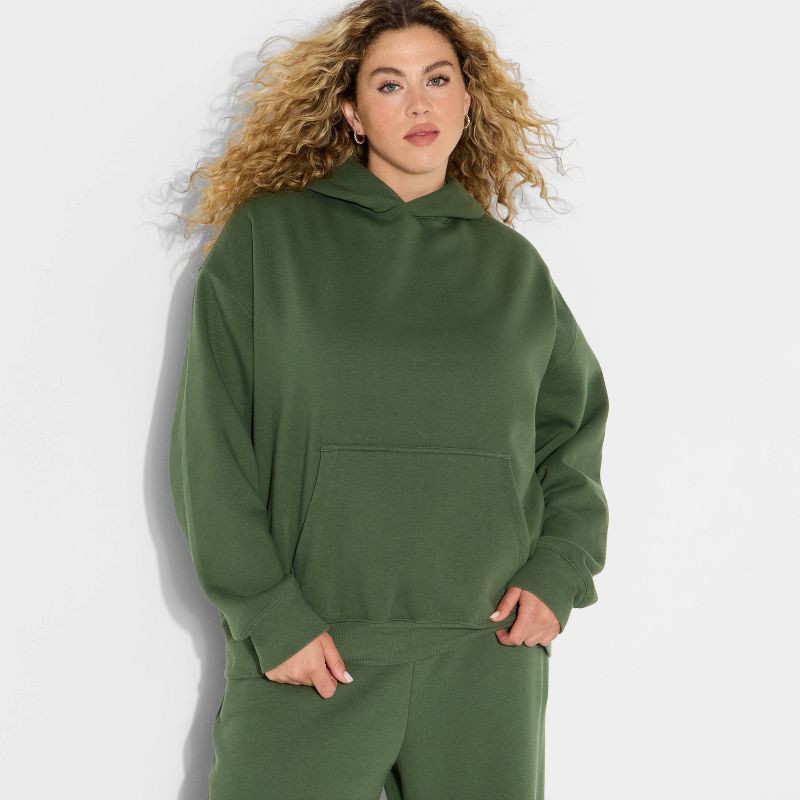 slide 1 of 3, Women's Oversized Bubble Hem Hooded Sweatshirt - Wild Fable™ Dark Green XXL, 1 ct
