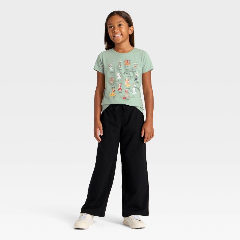 slide 4 of 4, Girls' Disney 'Nice List' Dogs and Cats Holiday Short Sleeve Graphic T-Shirt - Green L, 1 ct
