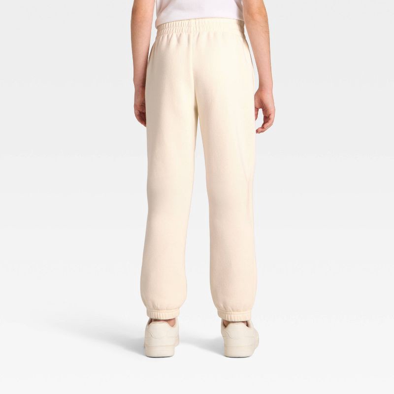 slide 5 of 5, Kids' Dr. Seuss The Grinch Fleece Sweatpants - Cream S, 1 ct