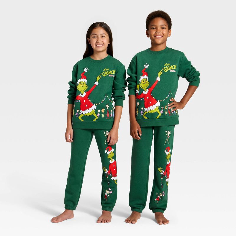 slide 1 of 5, Kids' Dr. Seuss The Grinch Evergreen Fleece Sweatpants - Dark Green M, 1 ct