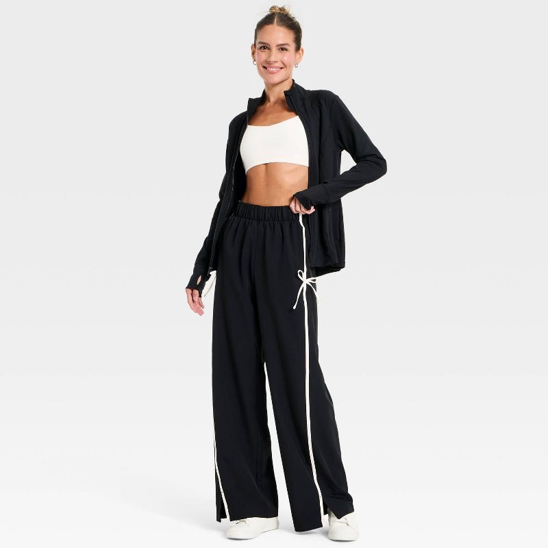 slide 3 of 5, Women's Woven High-Rise Bow Track Pants - All In Motion™ Black S, 1 ct