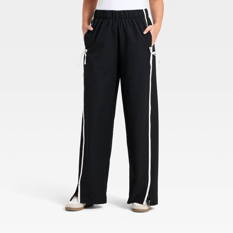 slide 5 of 5, Women's Woven High-Rise Bow Track Pants - All In Motion™ Black S, 1 ct