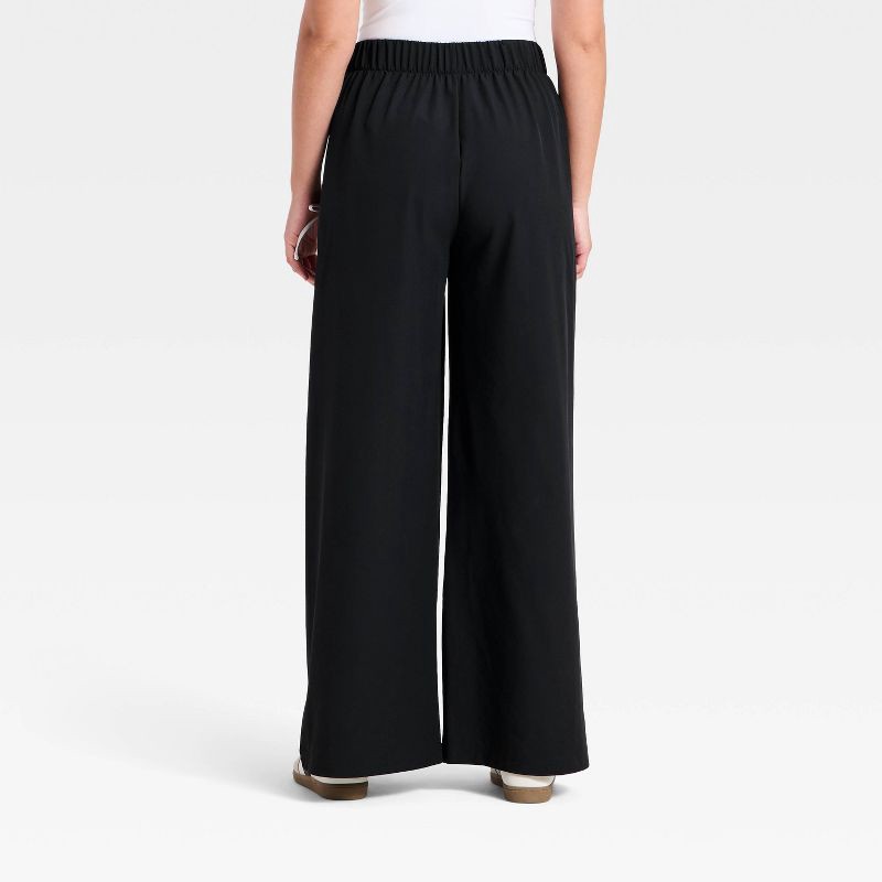 slide 2 of 5, Women's Woven High-Rise Bow Track Pants - All In Motion™ Black S, 1 ct