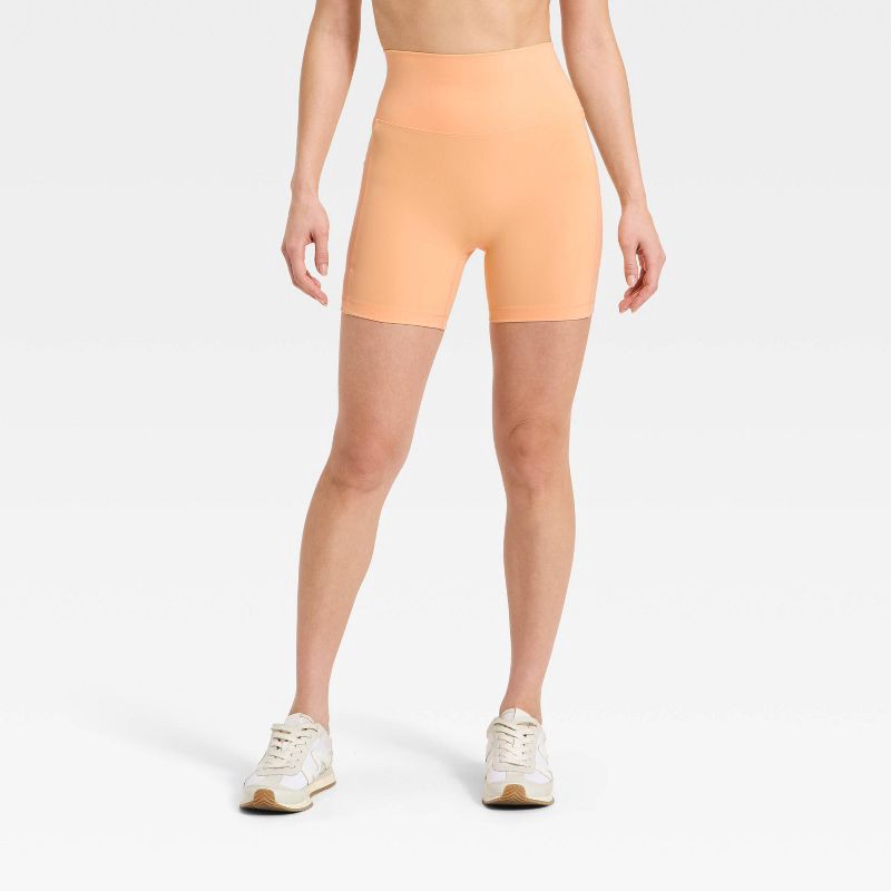 slide 1 of 5, Women's Super Flex High Rise Pocketed Bike Shorts 5" - All in Motion™ Melon Orange XS, 1 ct