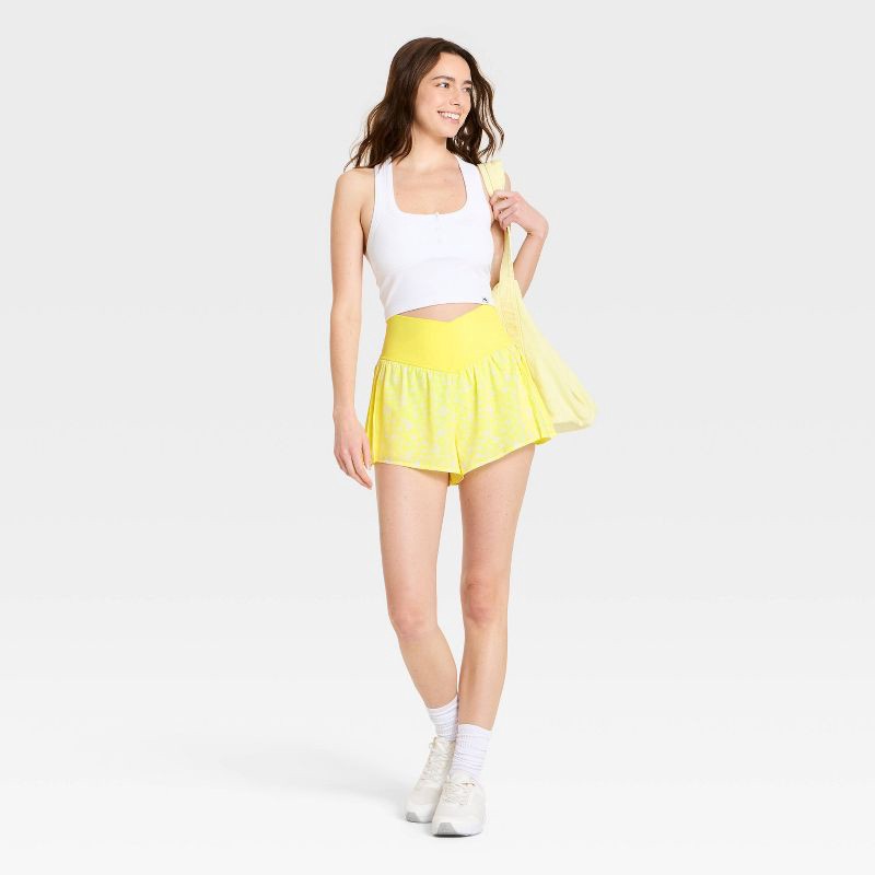 slide 3 of 4, Women's Pleated Side Woven Shorts - JoyLab™ Yellow Floral M, 1 ct