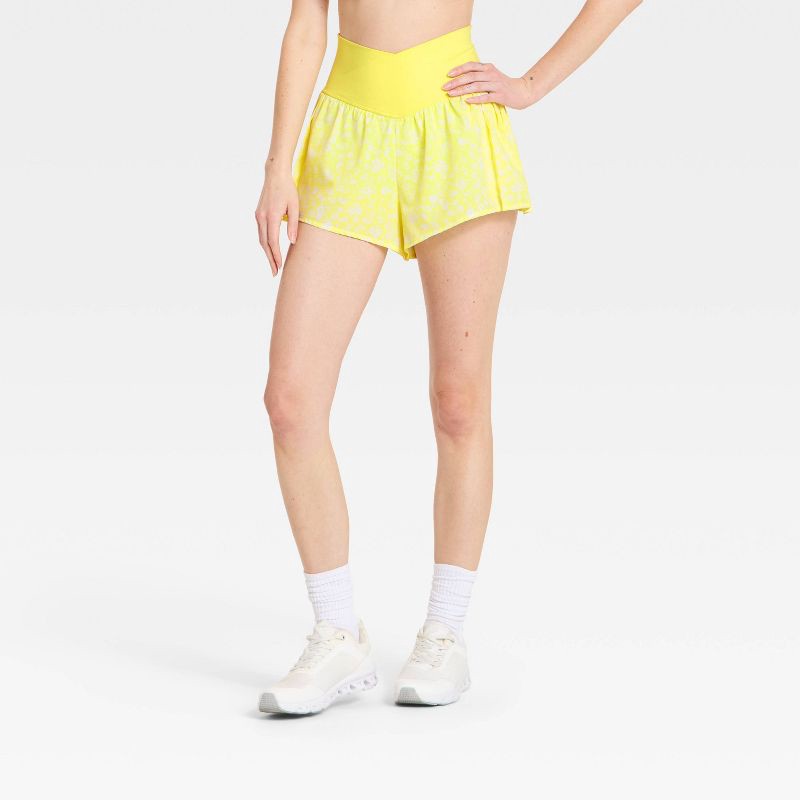 slide 1 of 4, Women's Pleated Side Woven Shorts - JoyLab™ Yellow Floral M, 1 ct