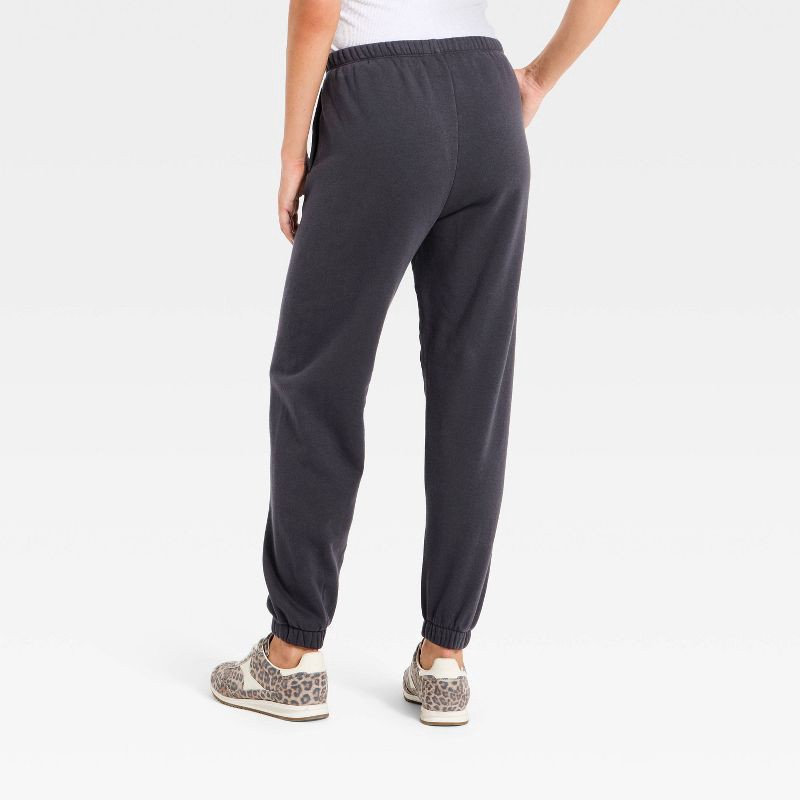slide 2 of 3, Women's Mid-Rise Fleece Jogger Pants - Universal Thread™ Charcoal Gray L, 1 ct