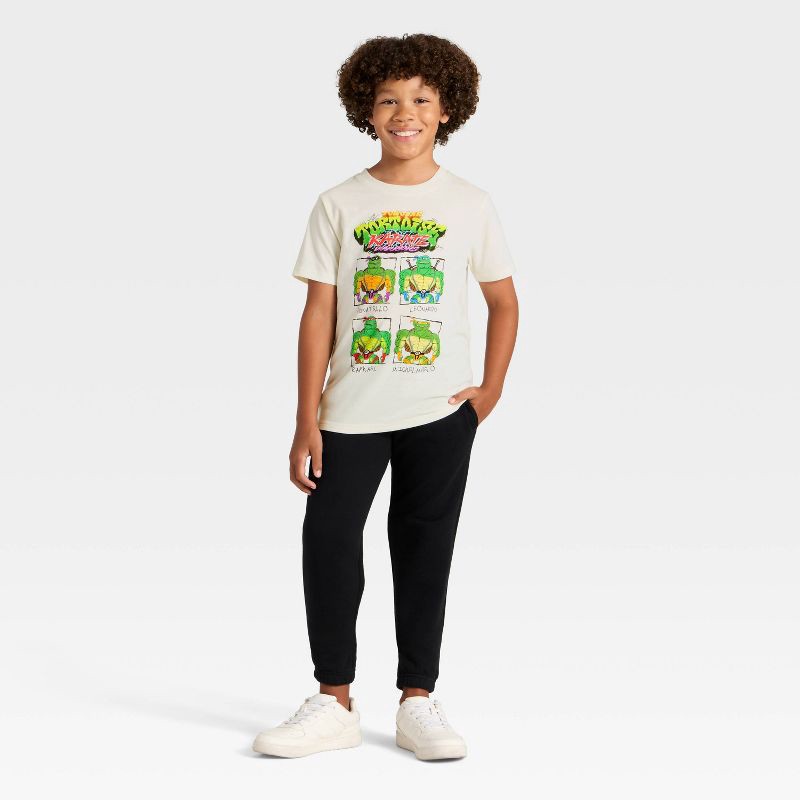 slide 4 of 4, Boys' Teenage Mutant Ninja Turtles Tortoise Karate Short Sleeve Graphic T-Shirt - Ivory XS, 1 ct