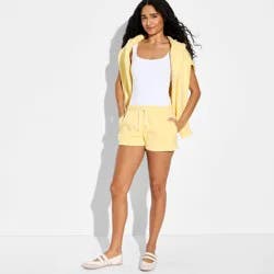 Women's Mid-Rise Fleece Pull-On Shorts - Wild Fable™ Light Yellow S