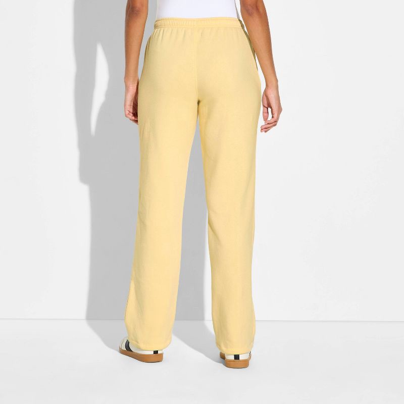 slide 3 of 3, Women's Mid-Rise Slim Straight Sweatpants - Wild Fable™ Light Yellow L, 1 ct