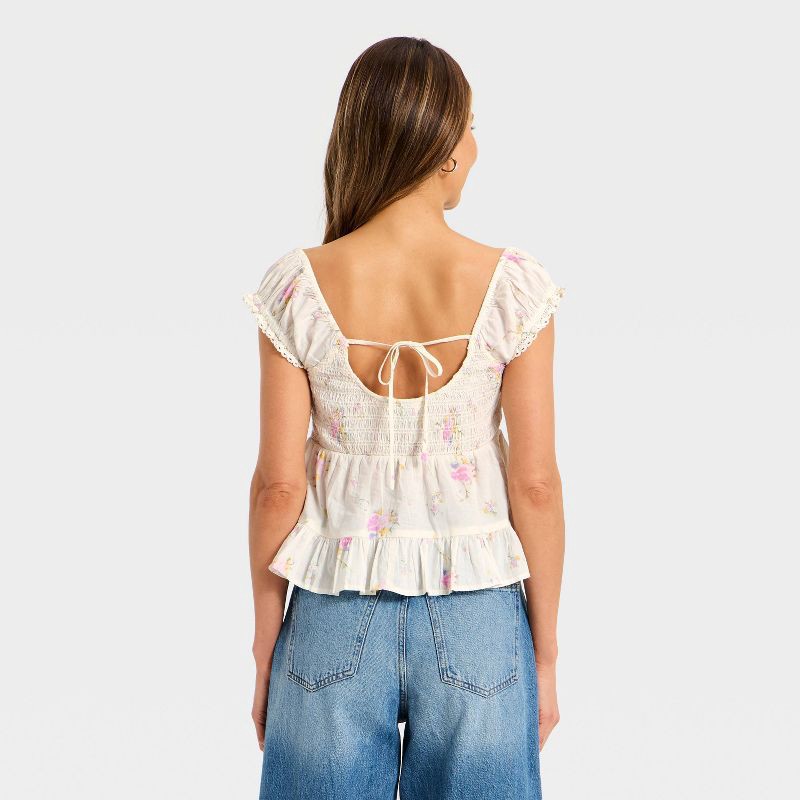 slide 2 of 3, Women's Puff Short Sleeve Pintuck V-Neck Blouse - Universal Thread™ Cream Floral M, 1 ct