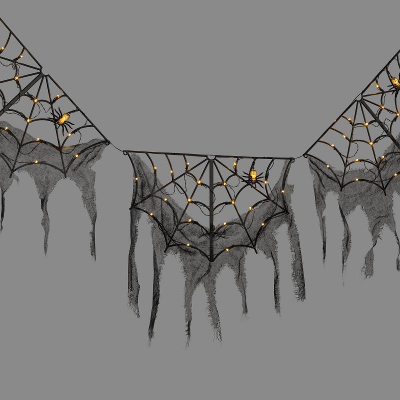 slide 1 of 5, 60ct LED Lit Color Selectable Black Halloween Web and Gauze Garland - Hyde and EEK! Boutique™, 60 ct