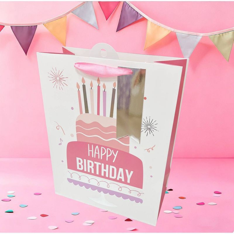 slide 2 of 3, Bows And Sparkles Medium Foil Print 'Happy Birthday' Cake Gift Bag with Tag White/Pink/Silver, 1 ct