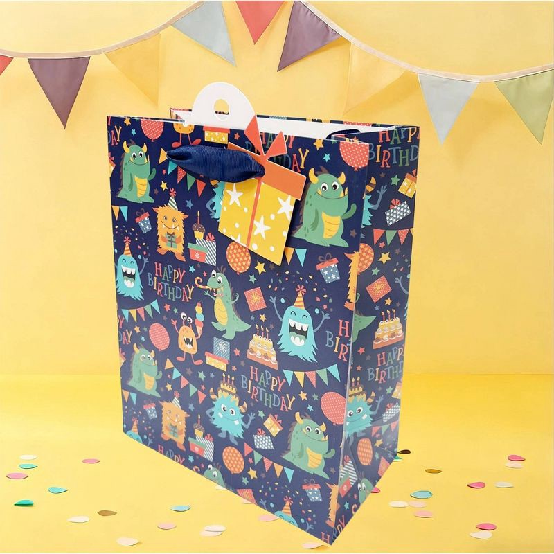 slide 2 of 3, Bows And Sparkles Small Monsters Birthday Gift Bag with Tag Navy, 1 ct