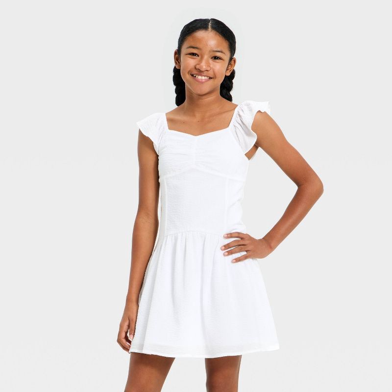 slide 1 of 3, Girls' Flutter Sleeve Drop Waist Dress - art class™ White L, 1 ct