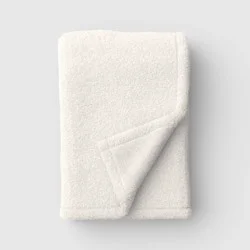 50"x70" Solid Comfort Plush Throw Ivory - Room Essentials™