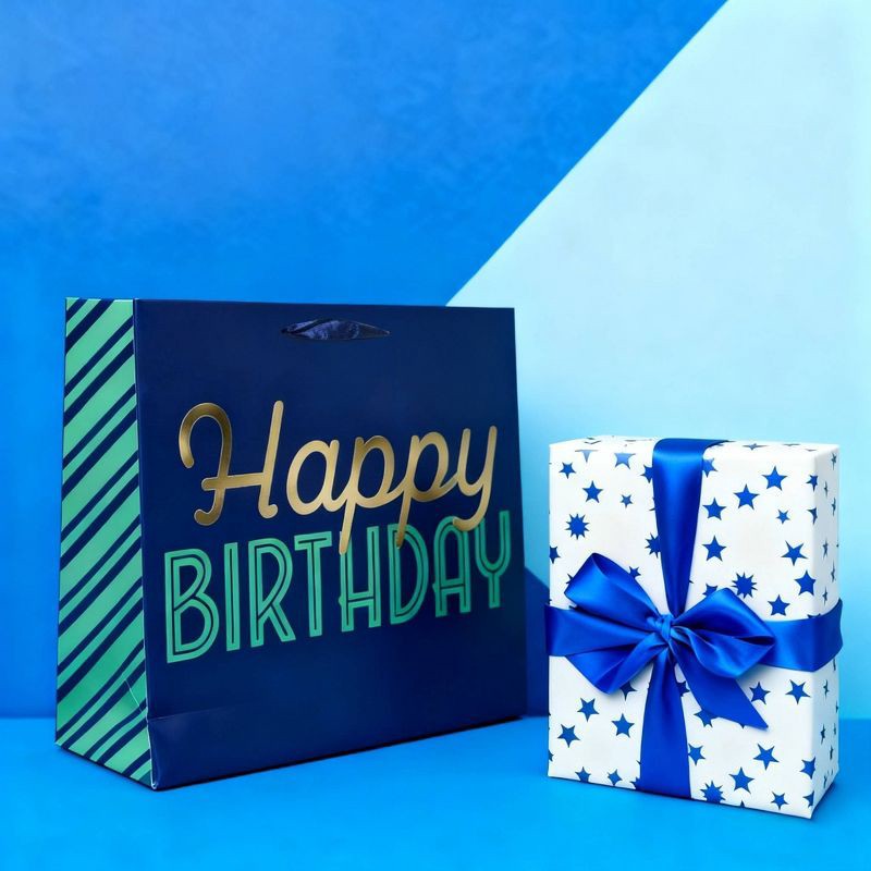 slide 2 of 3, Bows And Sparkles Large Foil Print 'Happy Birthday' Gift Bag with Tag Navy, 1 ct