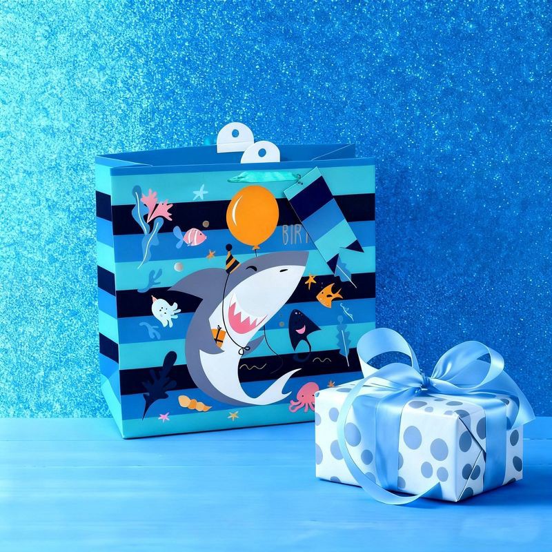 slide 2 of 3, Bows And Sparkles Large Square Striped Shark Birthday Gift Bag with Tag Navy/Blue, 1 ct