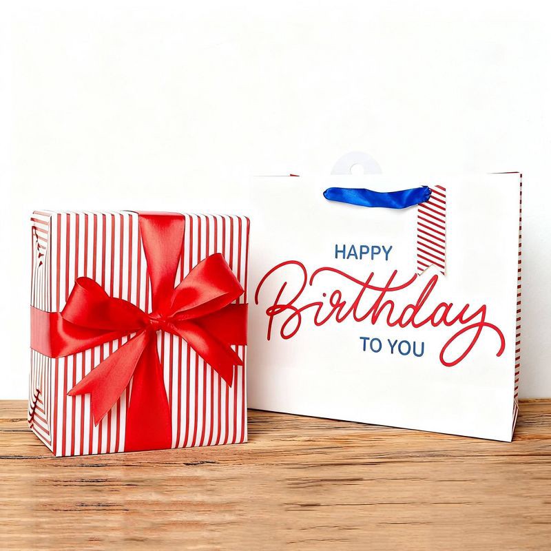 slide 2 of 3, Bows And Sparkles Large 'Happy Birthday to You' Gift Bag with Tag White/Blue/Red, 1 ct