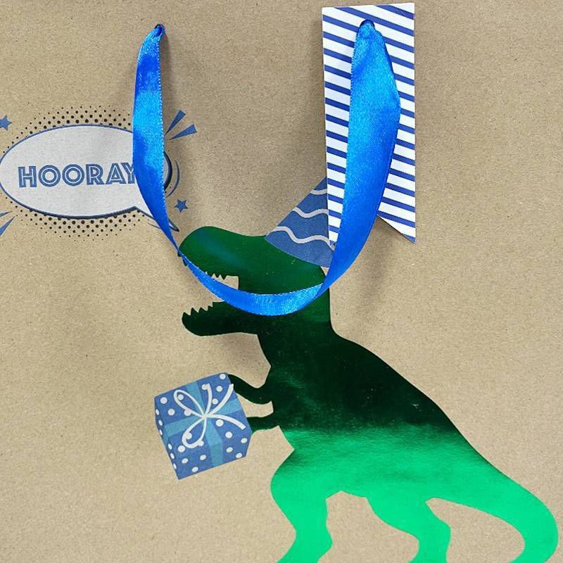 slide 3 of 3, Bows And Sparkles Medium 'Hooray' Foil Print Dinosaur Birthday Gift Bag with Tag Kraft Natural, 1 ct