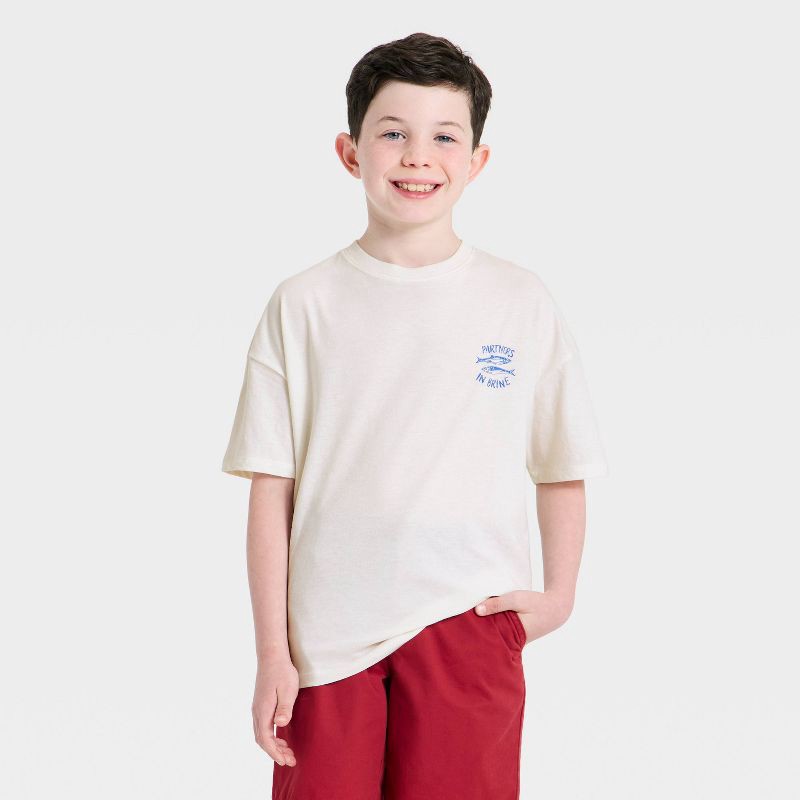 slide 1 of 4, Boys' Short Sleeve Partners in Brine Oversized Graphic T-Shirt - Cat & Jack™ Cream M, 1 ct