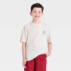 Boys' Short Sleeve Partners in Brine Oversized Graphic T-Shirt - Cat & Jack™ Cream M