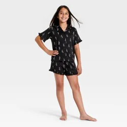 Girls' 2pc Halloween Cowboy Skeletons Button-Down Pajama Set - art class™ Black S