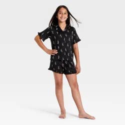 Girls' 2pc Halloween Cowboy Skeletons Button-Down Pajama Set - art class™ Black S