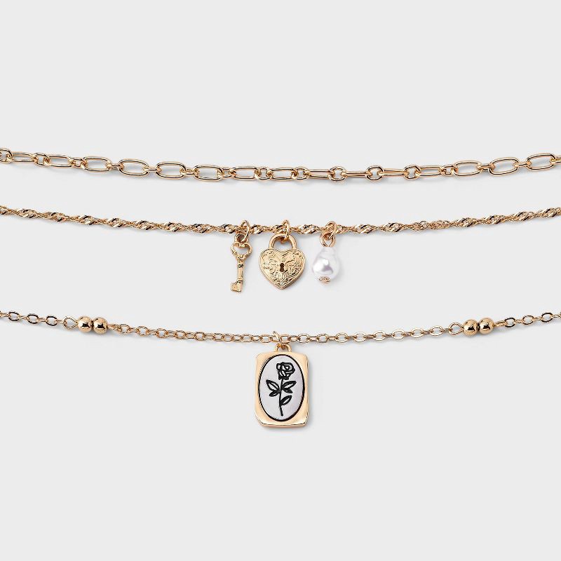 slide 1 of 3, Girls' Key and Lock Charm Necklace Set 3pc - art class™ Gold, 3 ct