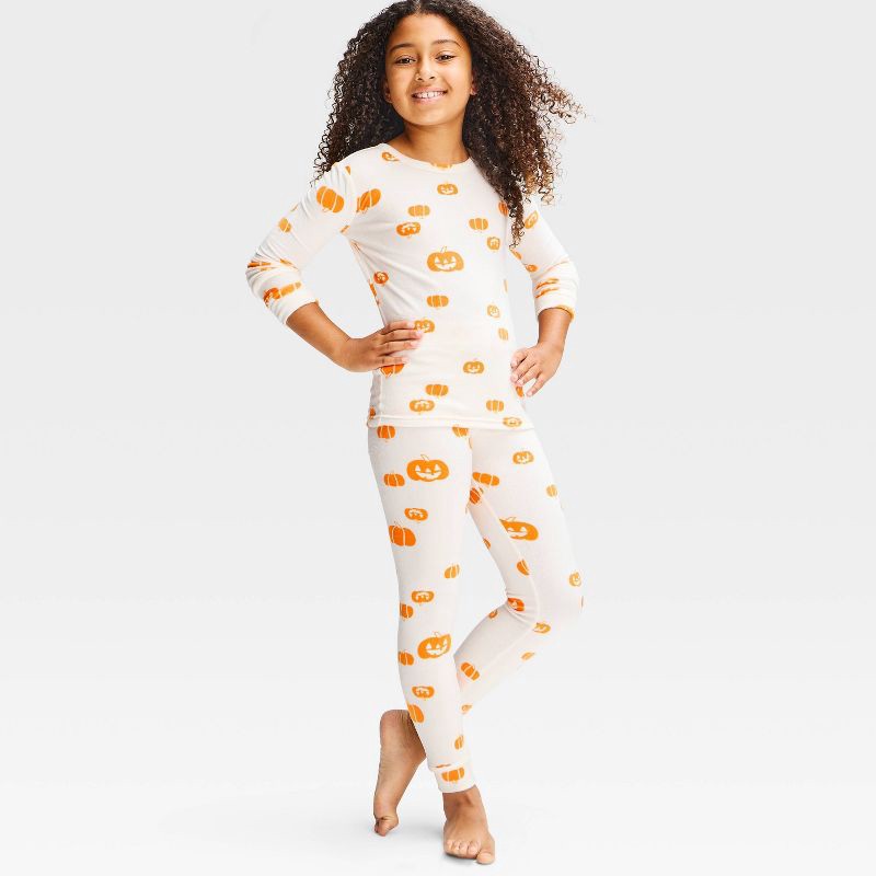 slide 1 of 3, Girls' Halloween Pumpkin Printed Tight Fit Snuggly Soft 2pc Pajama Set - Cat & Jack™ Cream 10, 2 ct