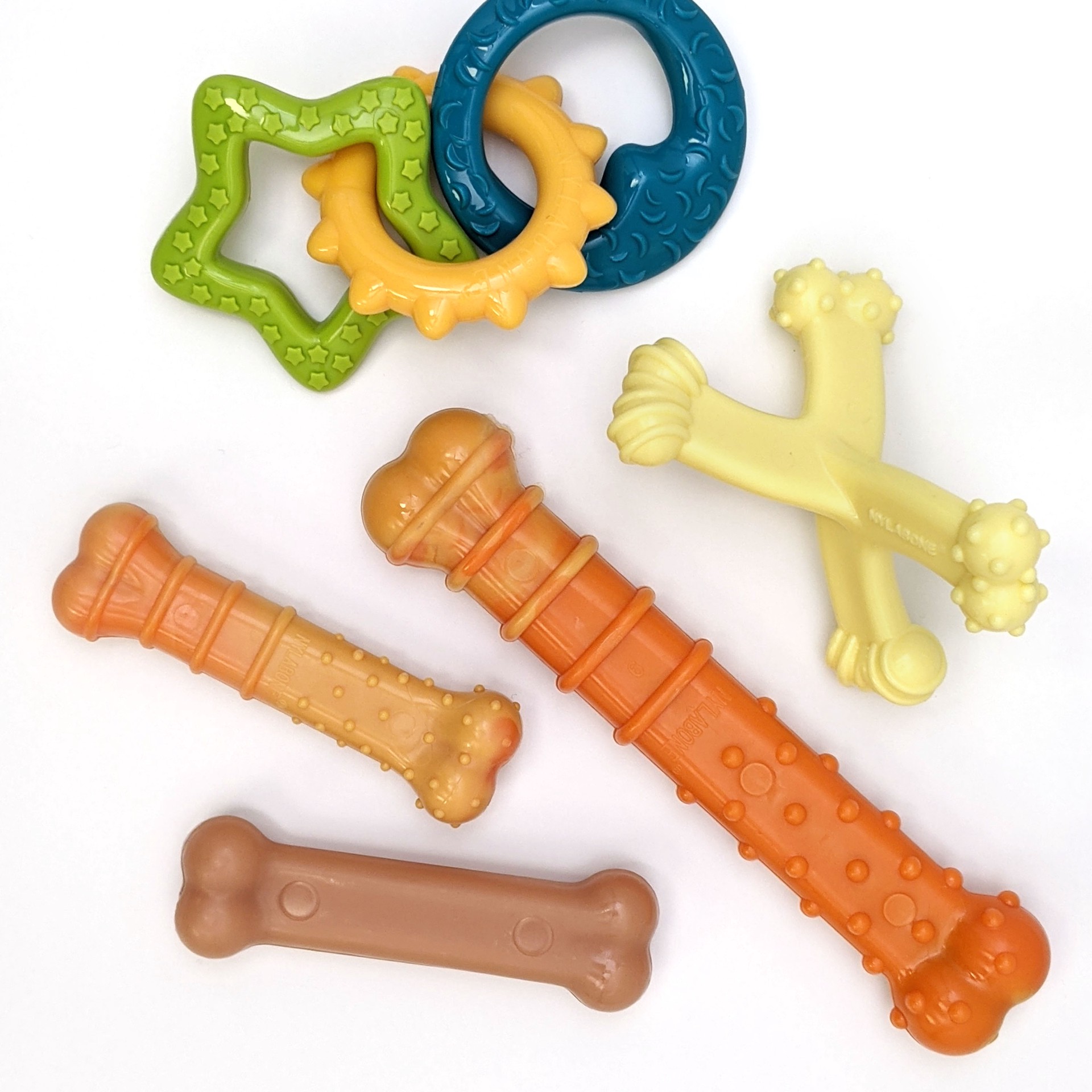 slide 2 of 10, Nylabone Puppy Power Chew Puppy Teething Rings Bacon Yellow Small/Regular - Up to 25 Ibs.(1 Count), 1 ct