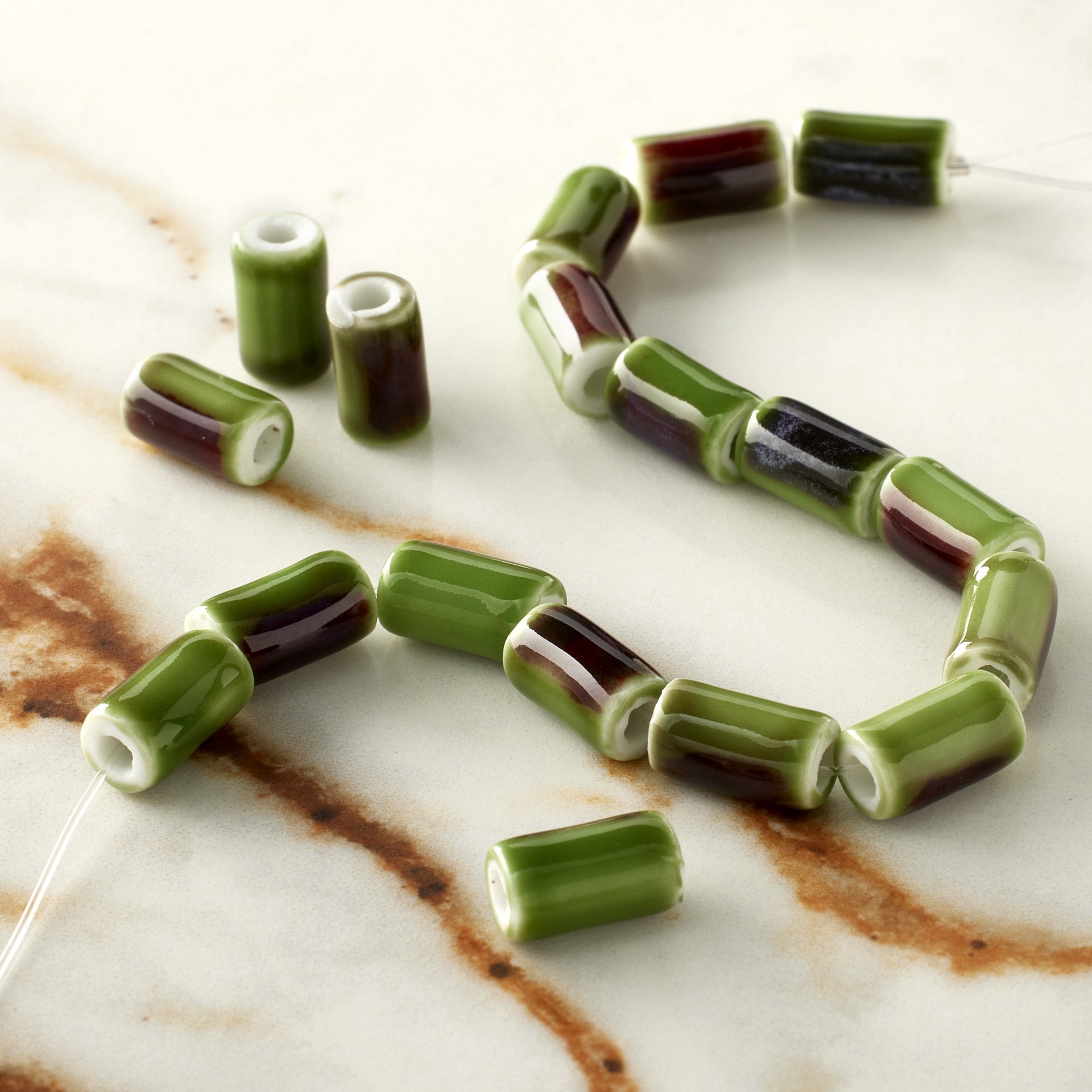 slide 2 of 3, Green Ceramic Tube Beads, 9.8mm By Bead Landing, 9.8mm
