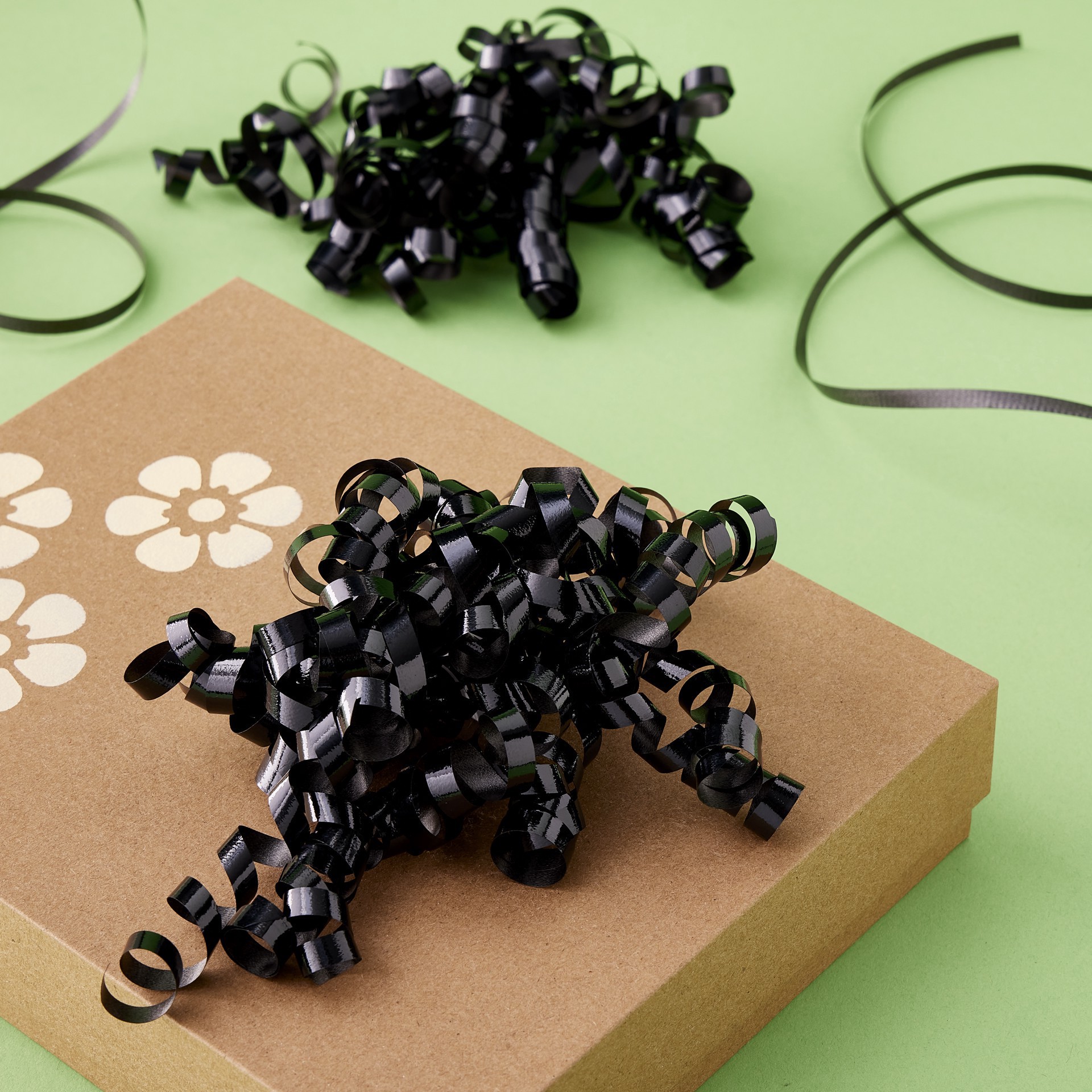 slide 2 of 3, Black Twisty Bows By Celebrate It, 0.25 in x 30 in