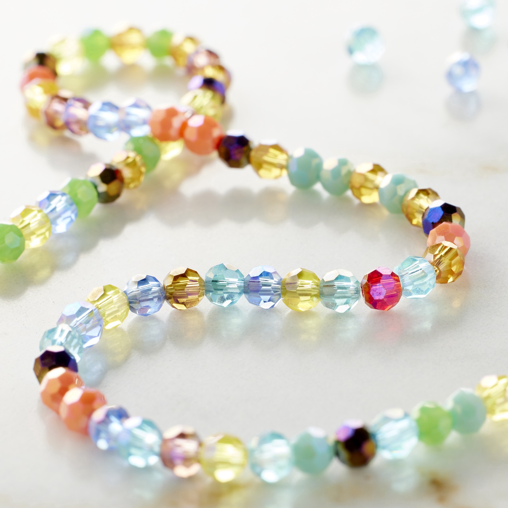 slide 3 of 3, 3mm Multicolor Aurora Borealis Faceted Glass Round Beads By Bead Landing, 3 mm