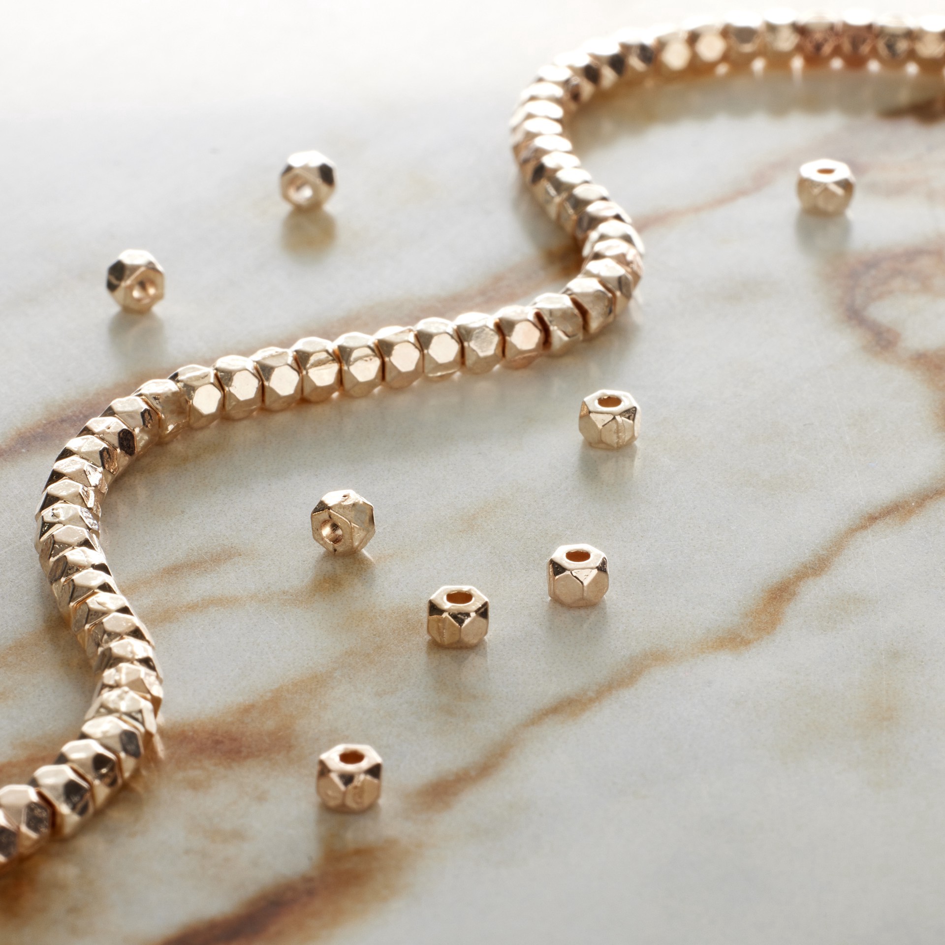 slide 3 of 3, Rose Gold Faceted Metal Cube Beads, 3mm By Bead Landing, 3 mm