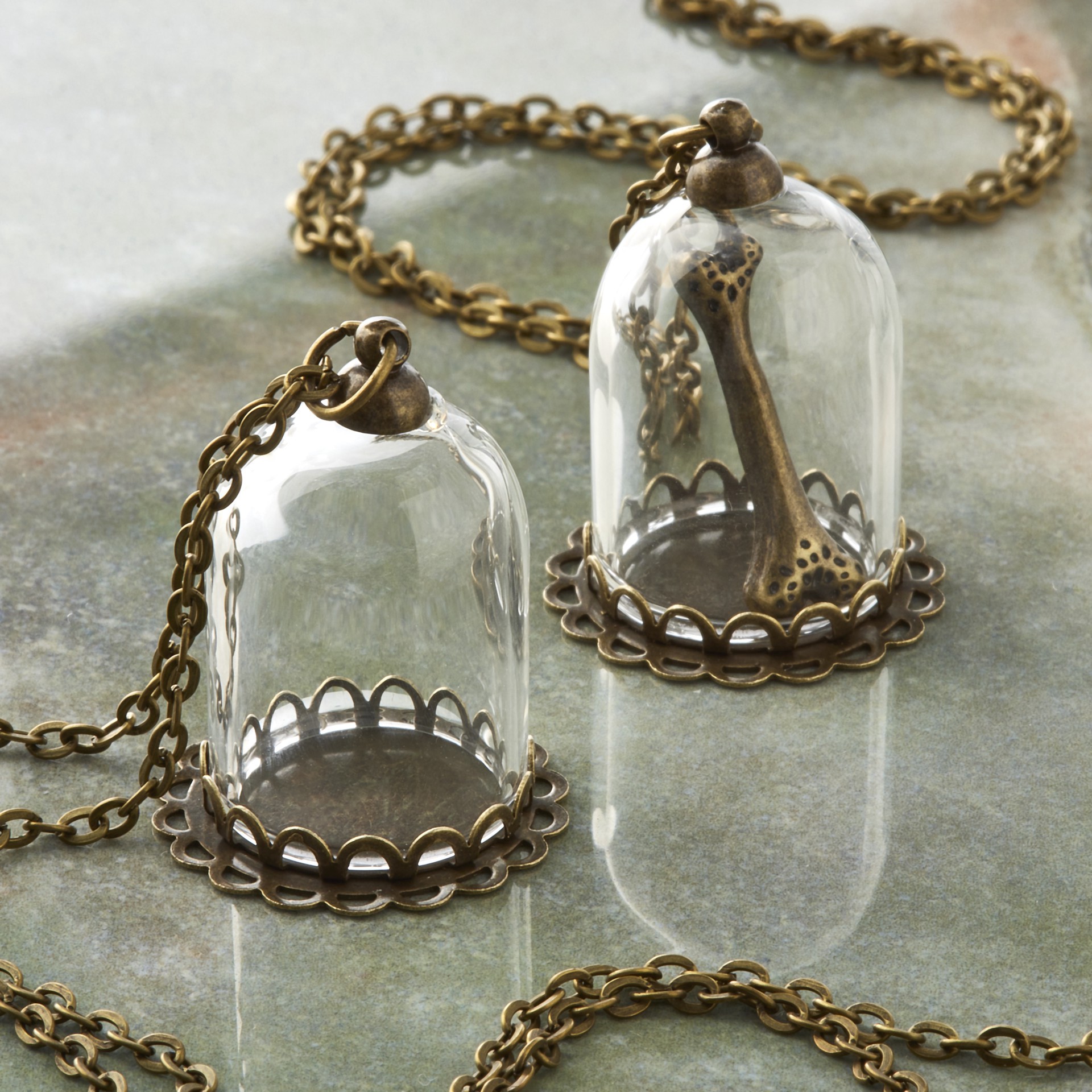 slide 2 of 3, Found Objects Oxidized Brass Small Bottle Charms By Bead Landing, 18mm x 25mm
