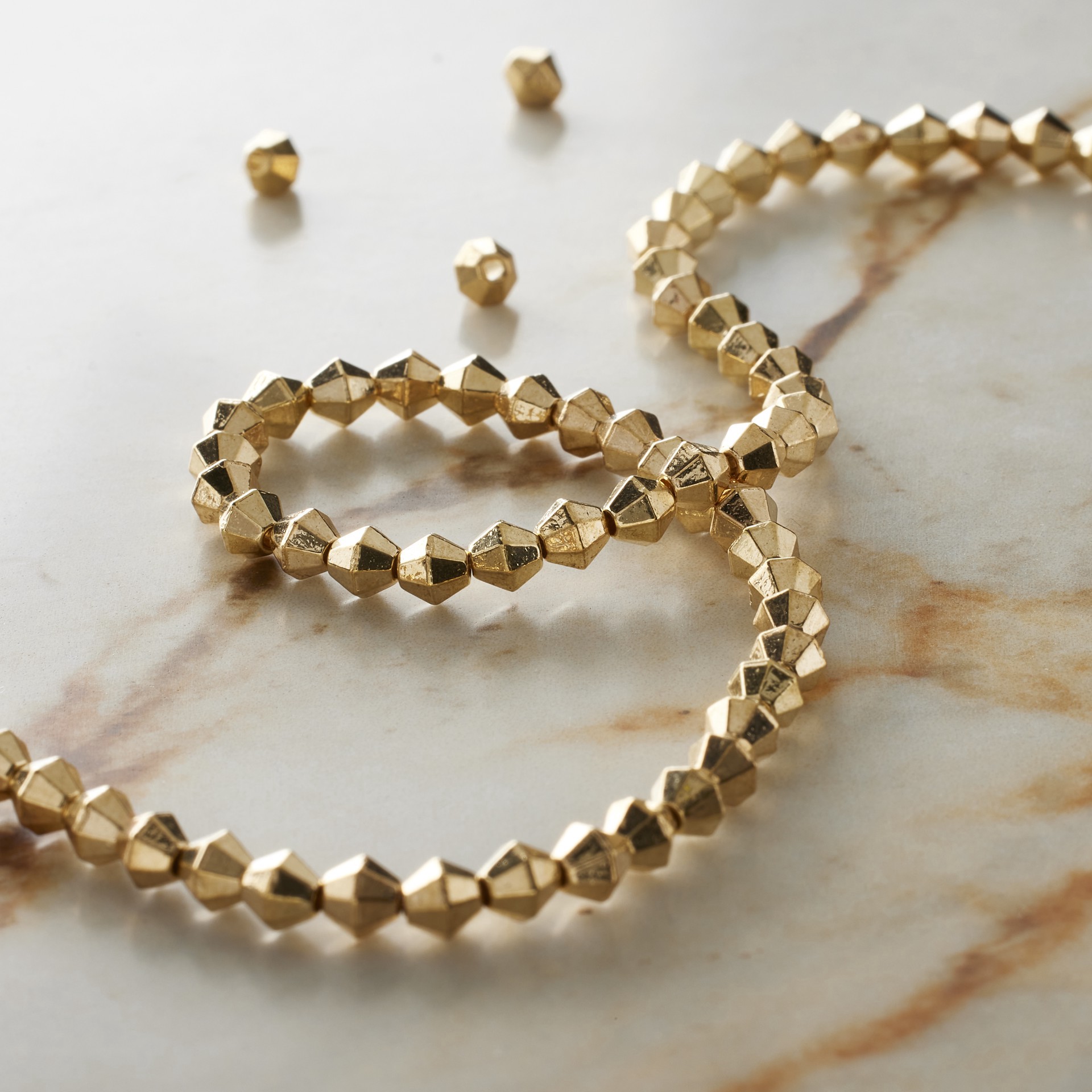 slide 3 of 3, Gold Metal Faceted Bicone Beads, 4mm By Bead Landing, 4 mm